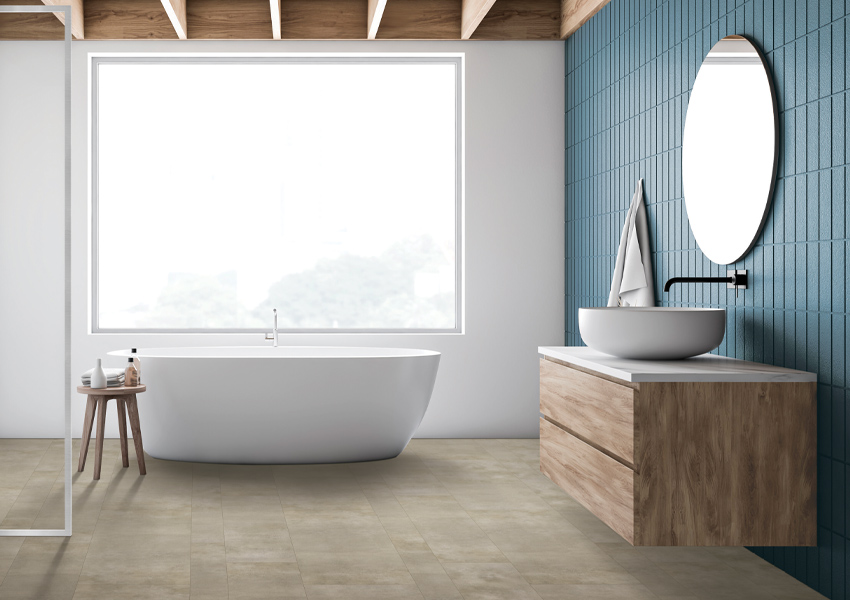 stone look luxury vinyl tile flooring in bathroom with bathtub and floating vanity.